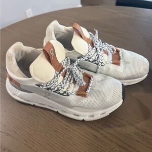 On Running Cream and Brown Sneakers